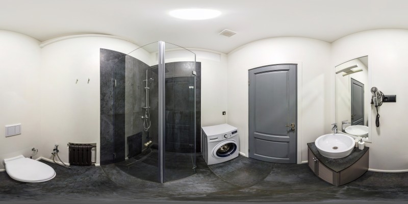 Efficient and Stylish: Small Bathroom Design with Washing Machine, Dryer, and Storage